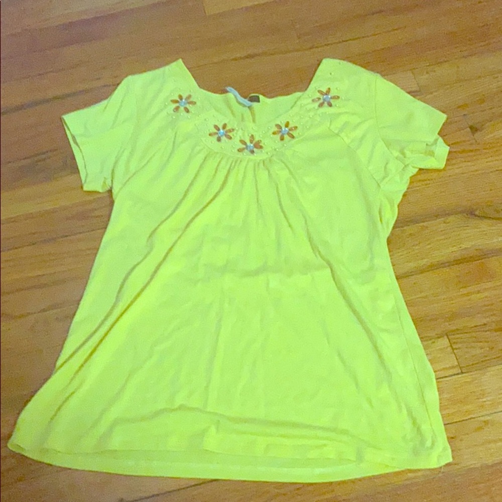 Yellow shirt with beads on it